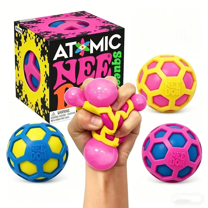 Boîte Mystère NeeDoh Atomic contenant un squishy sensoriel surprise à collectionner.